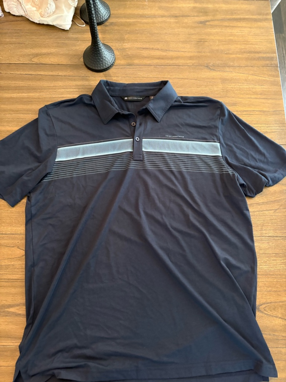 Travis Mathew Navy Polo with Light Blue Stripe